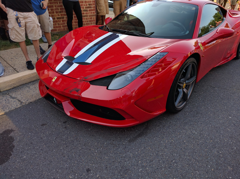 Illustration for article titled Ferrari 458 Speciale Mutilated In Front Of Children At Cars & Coffee